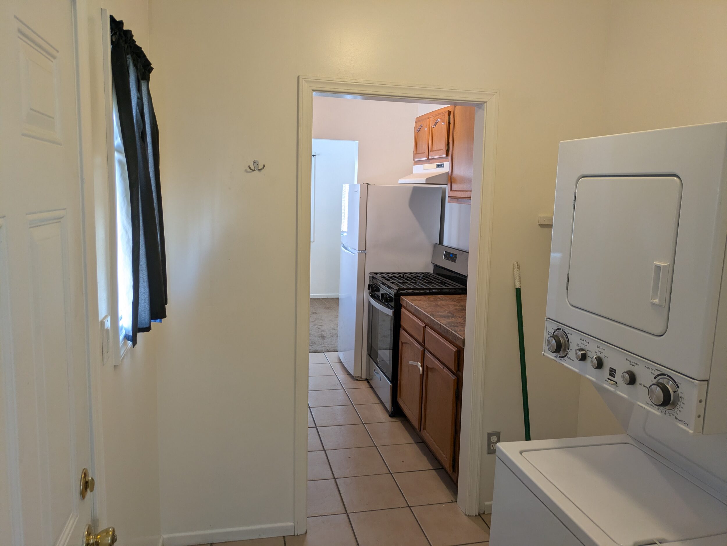 Utility room looking towards kitchen, back door to the left
